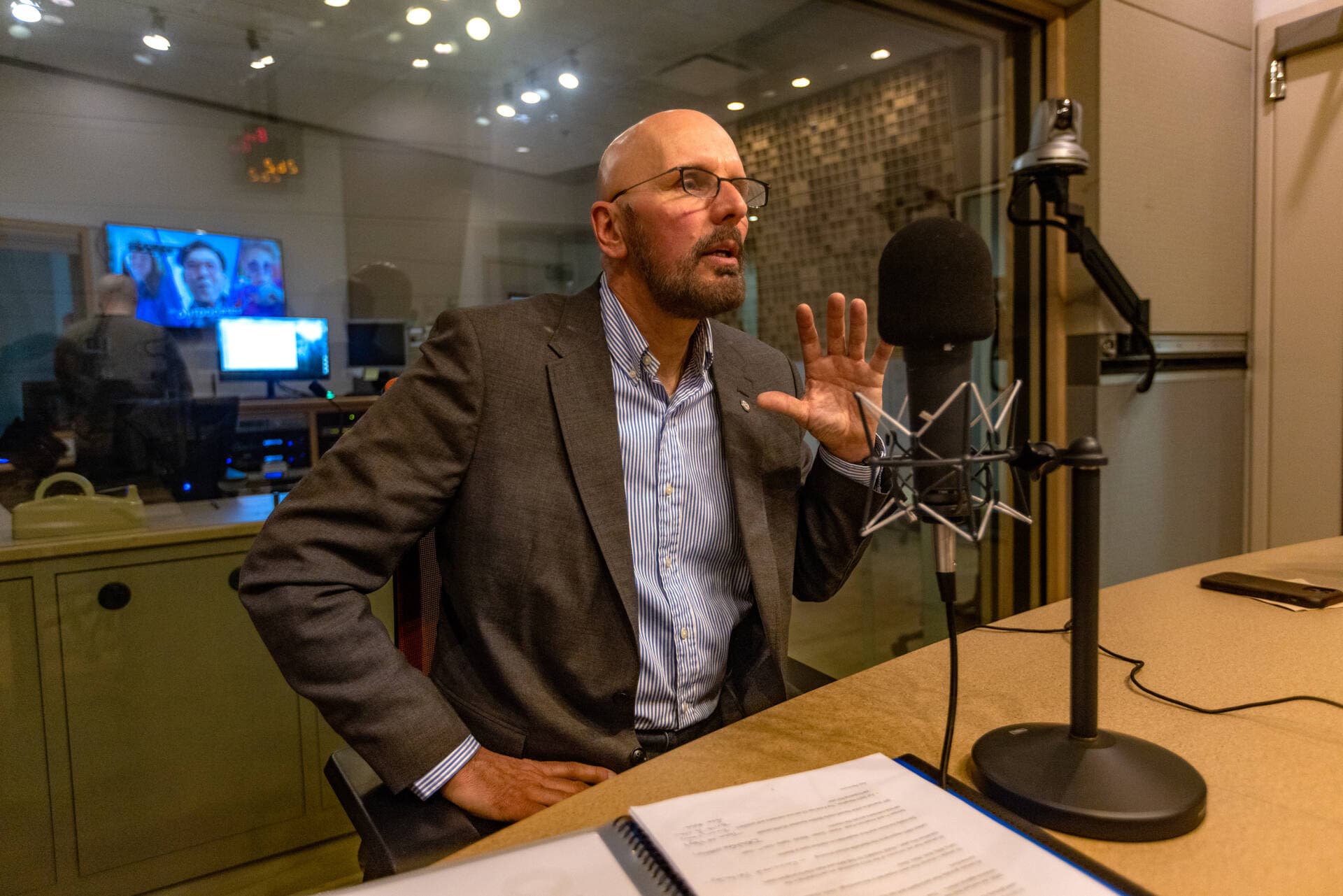 Dave Fortier, founder and president of One World Strong and a survivor of the 2013 Boston Marathon bombings, in the WBUR studios speaking with WBUR's Morning Edition host Rupa Shenoy. (Jesse Costa/WBUR)