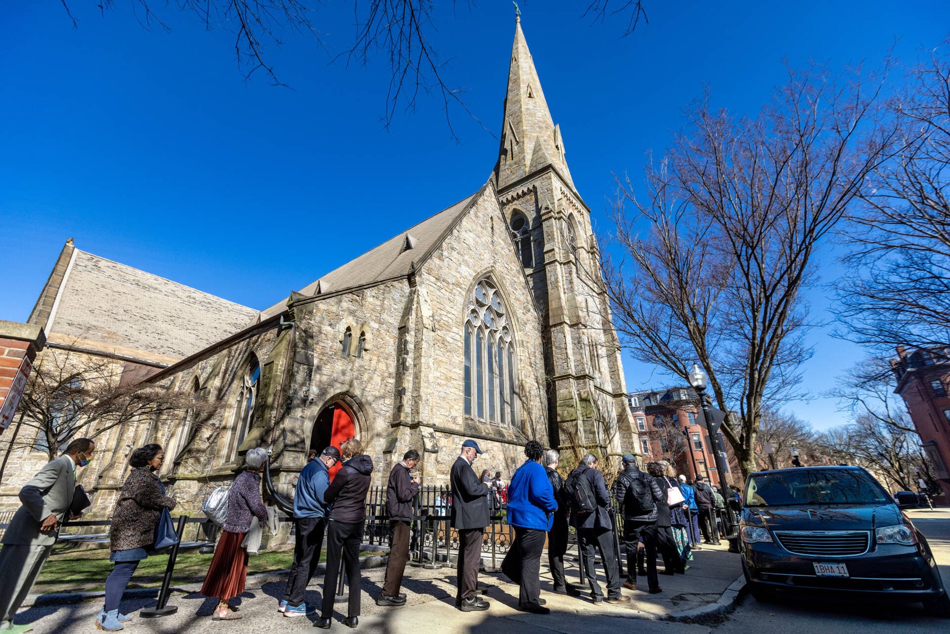 A line of people stretches down West Rutland Square and through Titus Sparrow Park for the public viewing of Mel King at the Union United Methodist Church in the South End. (Jesse Costa/WBUR)