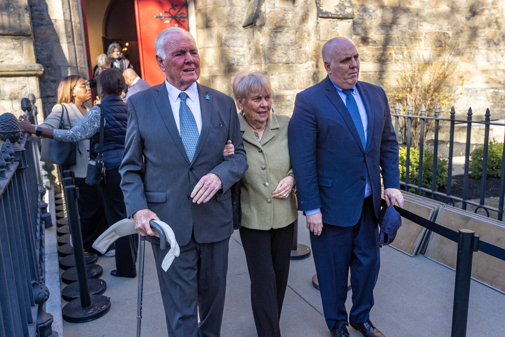 Former Mayor of Boston Ray Flynn, his wife Kathy and his son City Councilor Ed Flynn emerge from the Union United Methodist Church after visiting the body of the late Mel King. (Jesse Costa/WBUR)