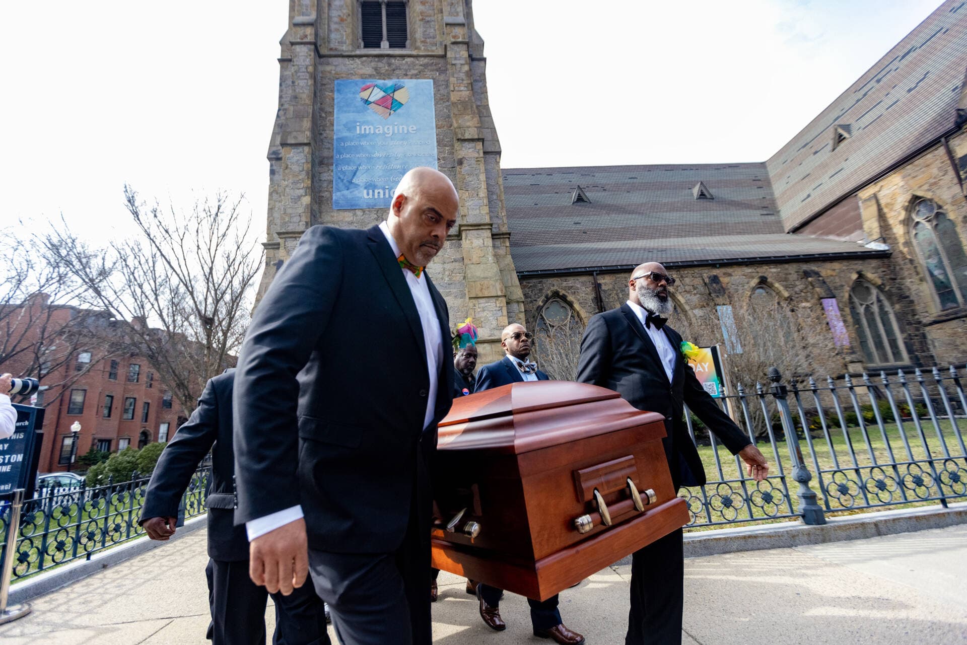 Pallbearers carry the casket of Mel King out of Union United Methodist Church. (Jesse Costa/WBUR)