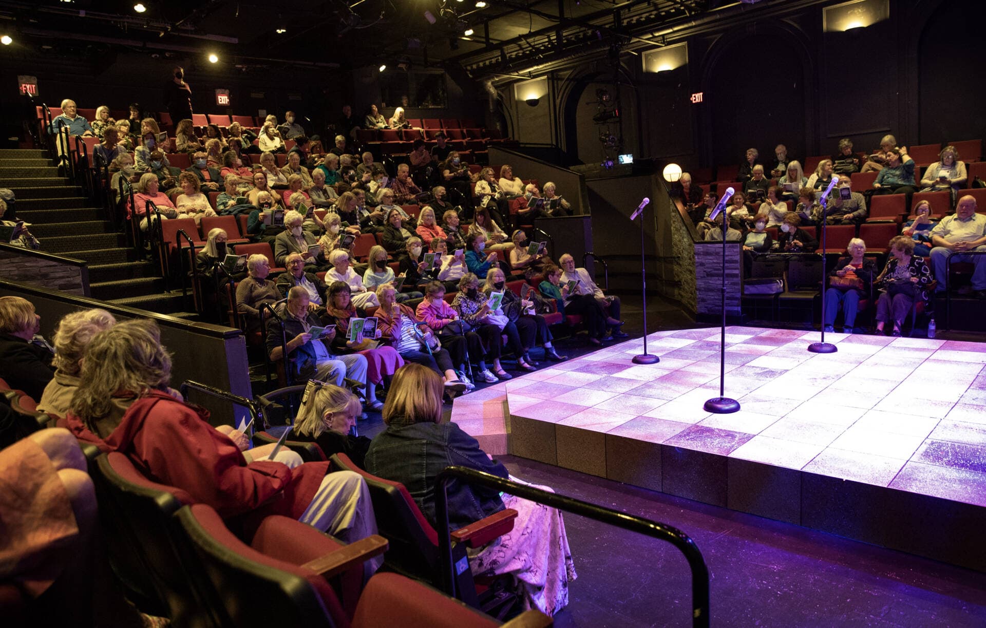 The audience gets settled before a matinee performance at the Lyric Stage Company of Boston. (Robin Lubbock/WBUR)