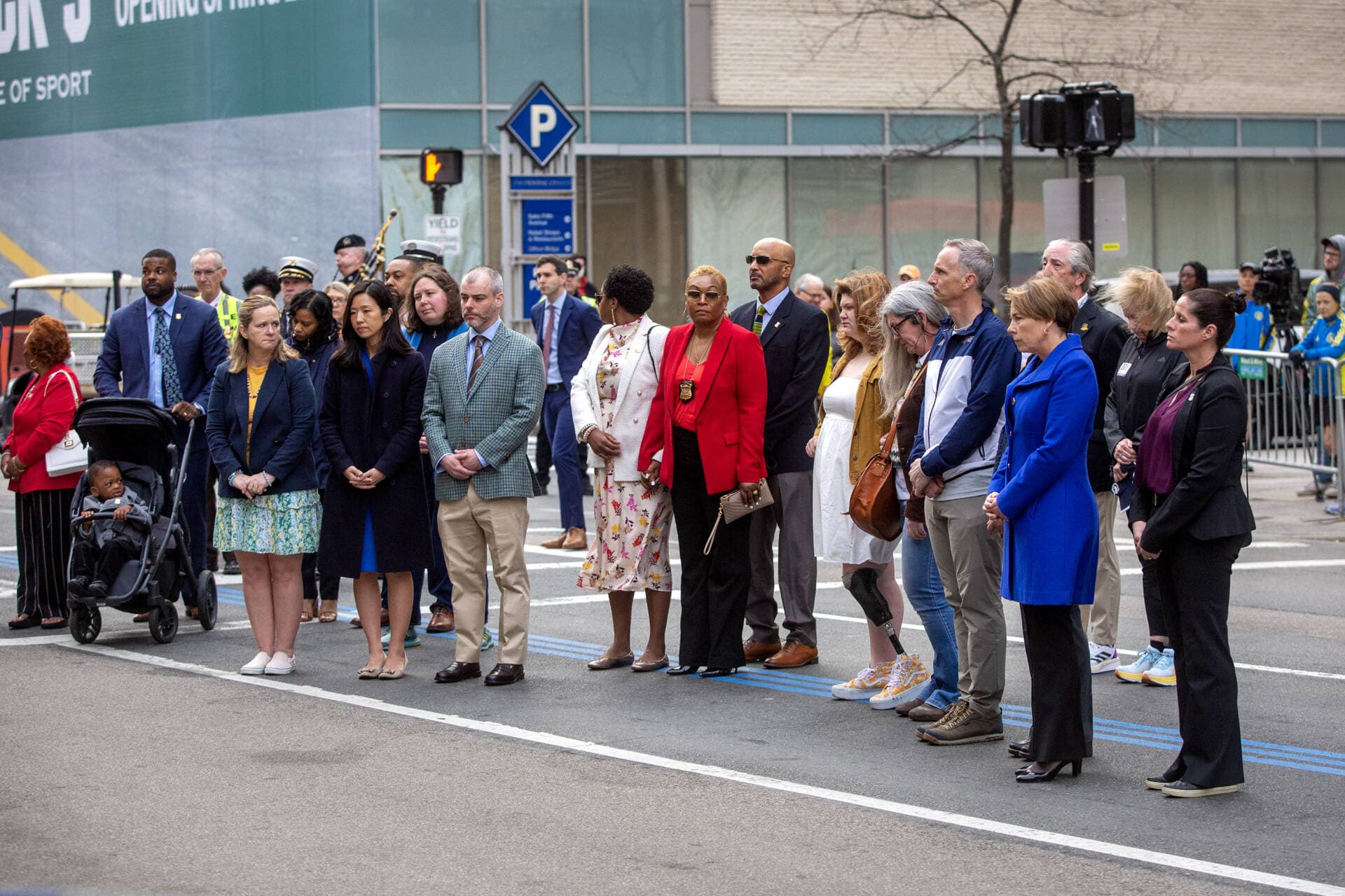 A brief and solemn ceremony was held early Saturday to mark the 10th anniversary of attack on the Boston Marathon. It was attended by several family members of victims of the bombings, as well as Gov. Maura Healey and Mayor Michelle Wu. (Robin Lubbock/WBUR)