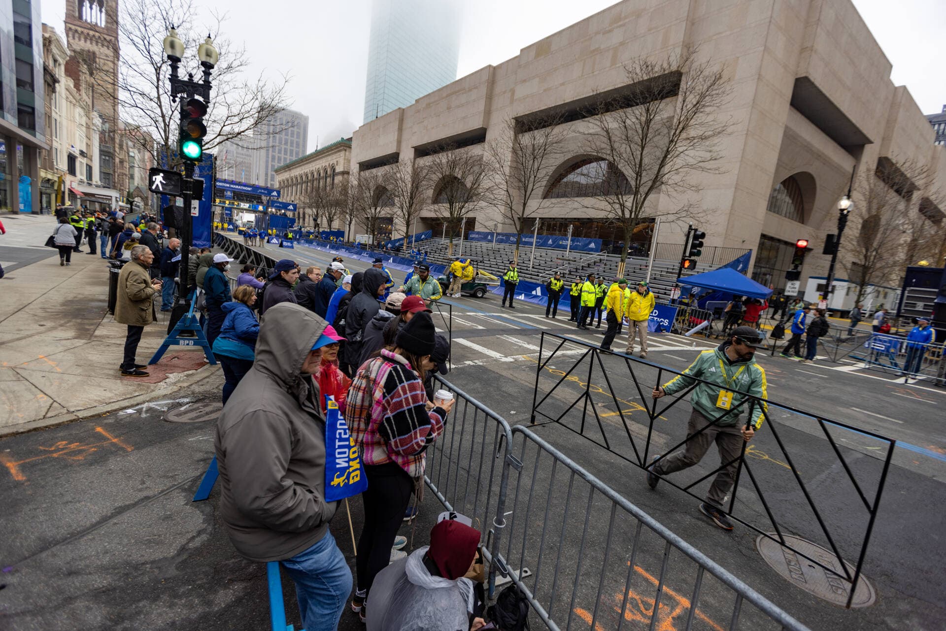 Spectators line the sides of Boylston Street waiting for the first runners to make their way downtown. (Jesse Costa/WBUR)