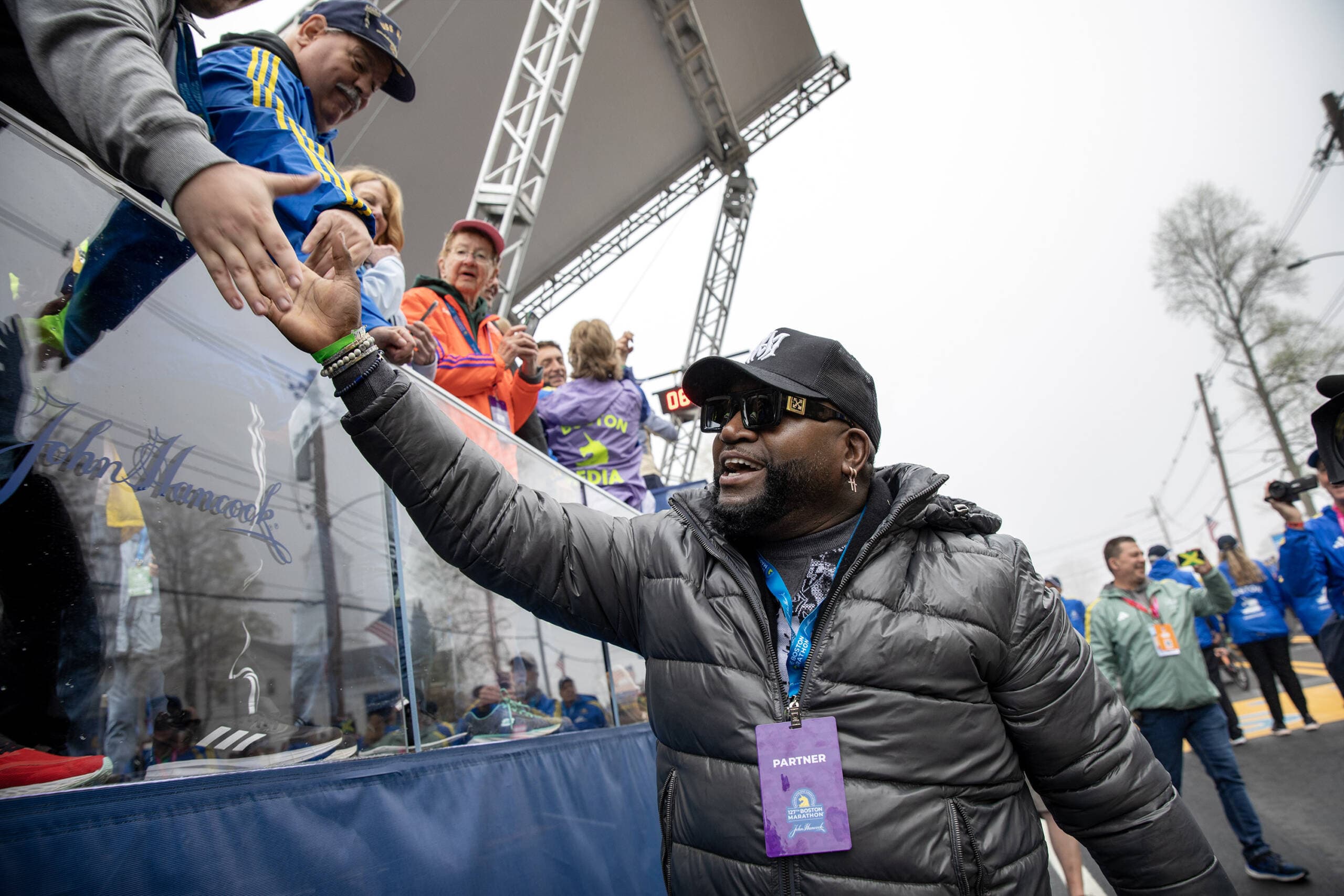 David Ortiz greets fans at the race's starting line. (Robin Lubbock/WBUR)