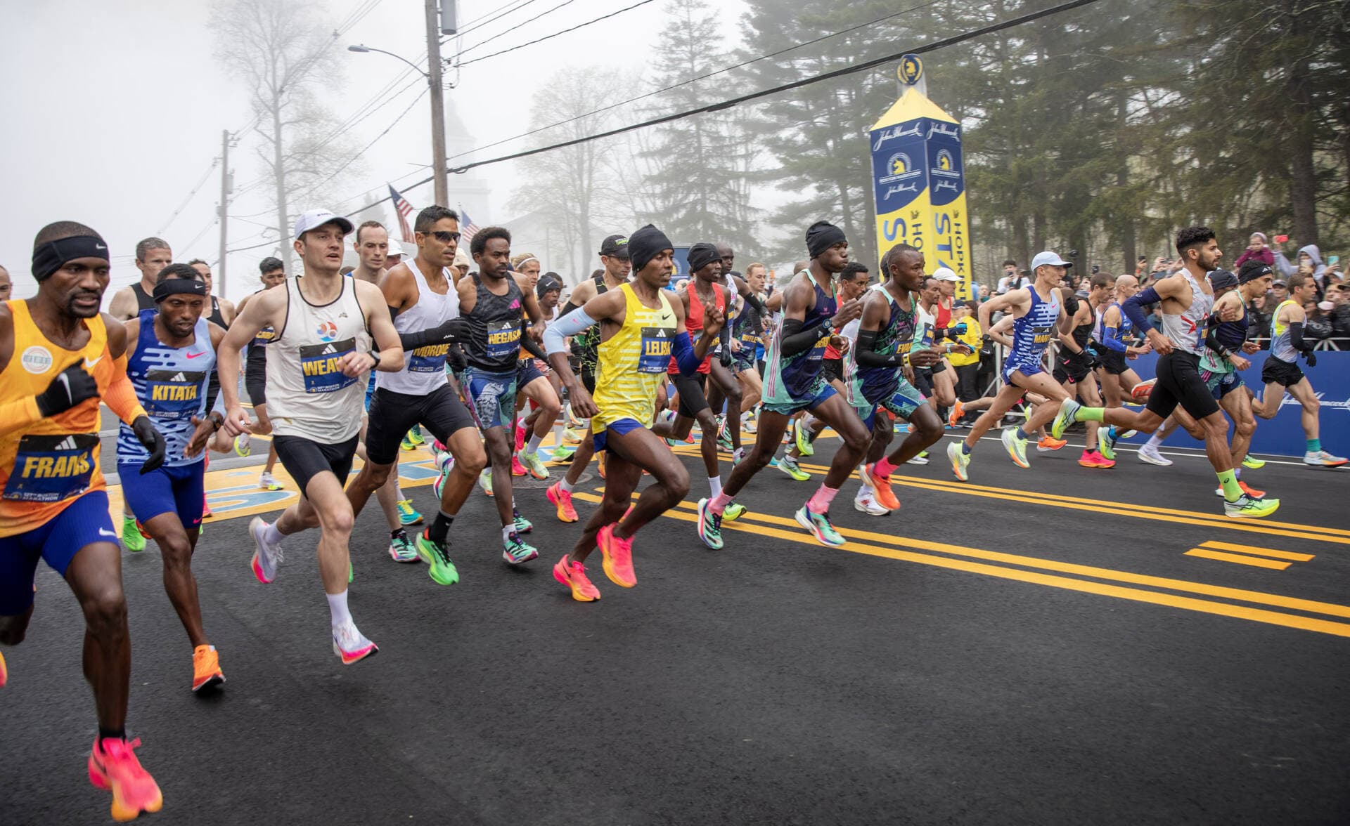 The men's professional field gets underway at the 127th Boston Marathon. (Robin Lubbock/WBUR)