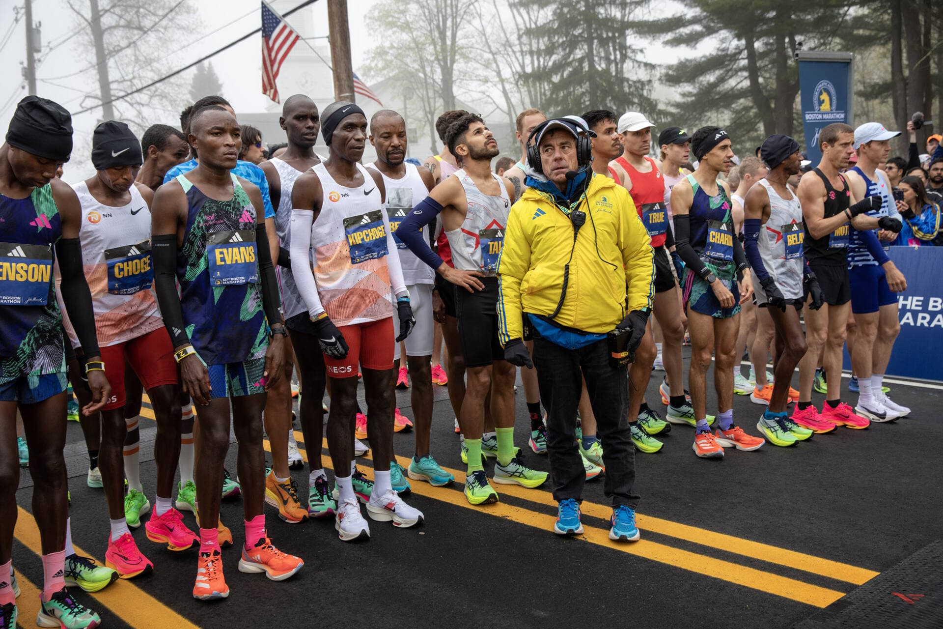 The men's professional field approaches the starting line at the 127th Boston Marathon. (Robin Lubbock/WBUR)