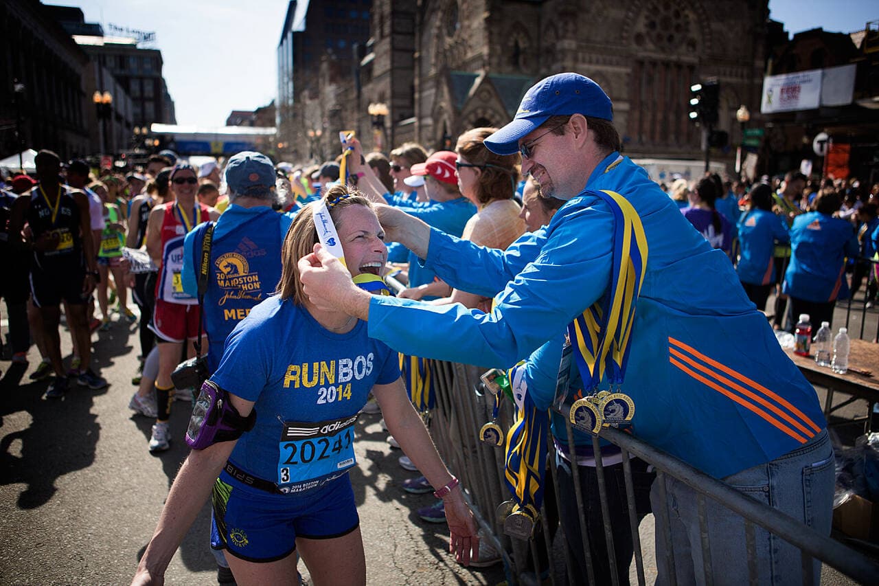 Amy Kentner, of Wapakoneta, Ohio receives her medal shortly after finishing the marathon. (Jesse Costa/WBUR)