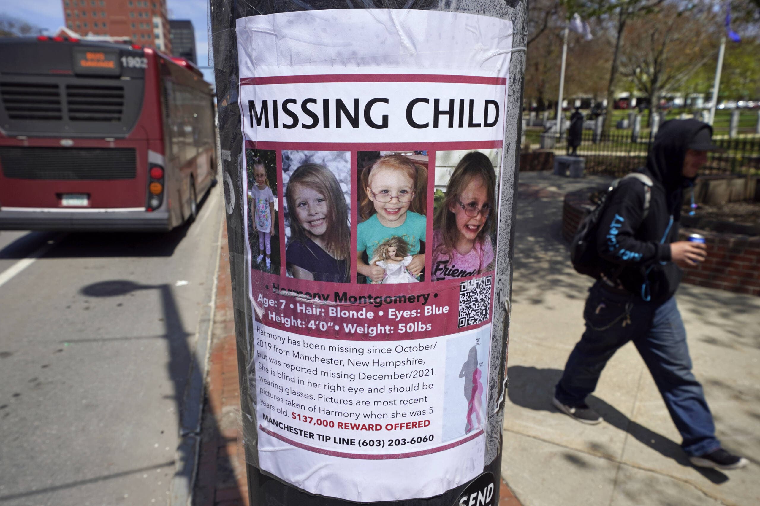 A man walks past the "missing child" poster for Harmony Montgomery on Thursday, May 5, 2022, in Manchester, N.H. (Charles Krupa/AP)
