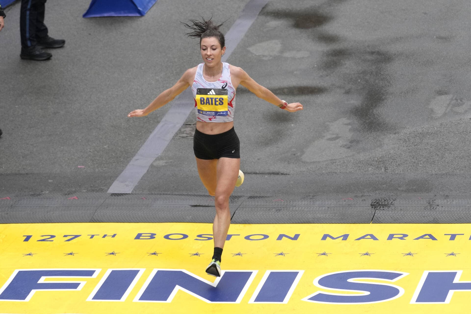 Emma Bates, of Minnesota, crosses the finish line of the Boston Marathon, Monday, April 17, 2023, in Boston. Bates was the top American woman finisher. (Charles Krupa/AP)
