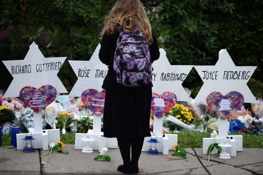 A woman stands at a memorial outside the Tree of Life synagogue after a shooting there left 11 people dead in the Squirrel Hill neighborhood of Pittsburgh on October 27, 2018. (Brendan Smialowski/AFP via Getty Images)