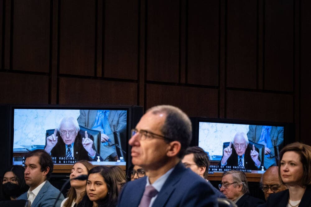 Video screens display a feed of Sen. Bernie Sanders (I-VT), as Moderna Inc. Chief Executive Officer Stephane Bancel testifies before the Senate Health, Education, Labor, and Pensions Committee on Capitol Hill on Wednesday, March 22, 2023. (Kent Nishimura / Los Angeles Times via Getty Images)