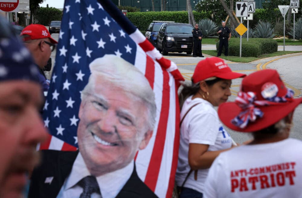 Supporters gather to show support as police officers guard the street outside former U.S. President Donald Trump's Mar-a-Lago home on April 1, 2023 in Palm Beach, Florida. (Alex Wong/Getty Images)