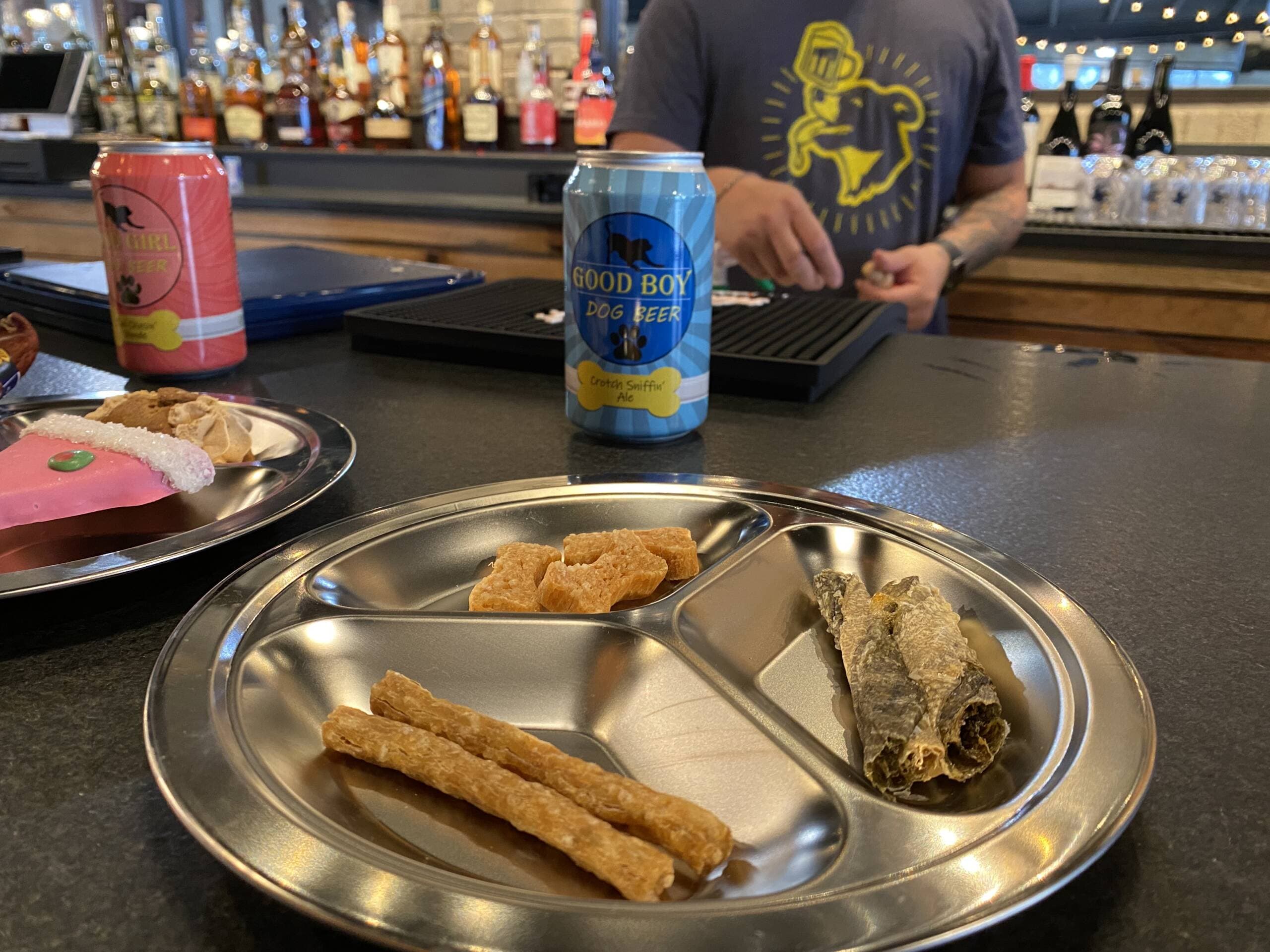 This flight of locally-made, artisan dog treats from Polkadog Bakery is a seafood trio with cod skins, salmon bones and a “Chowdah Stick.” (Andrea Shea/WBUR)
