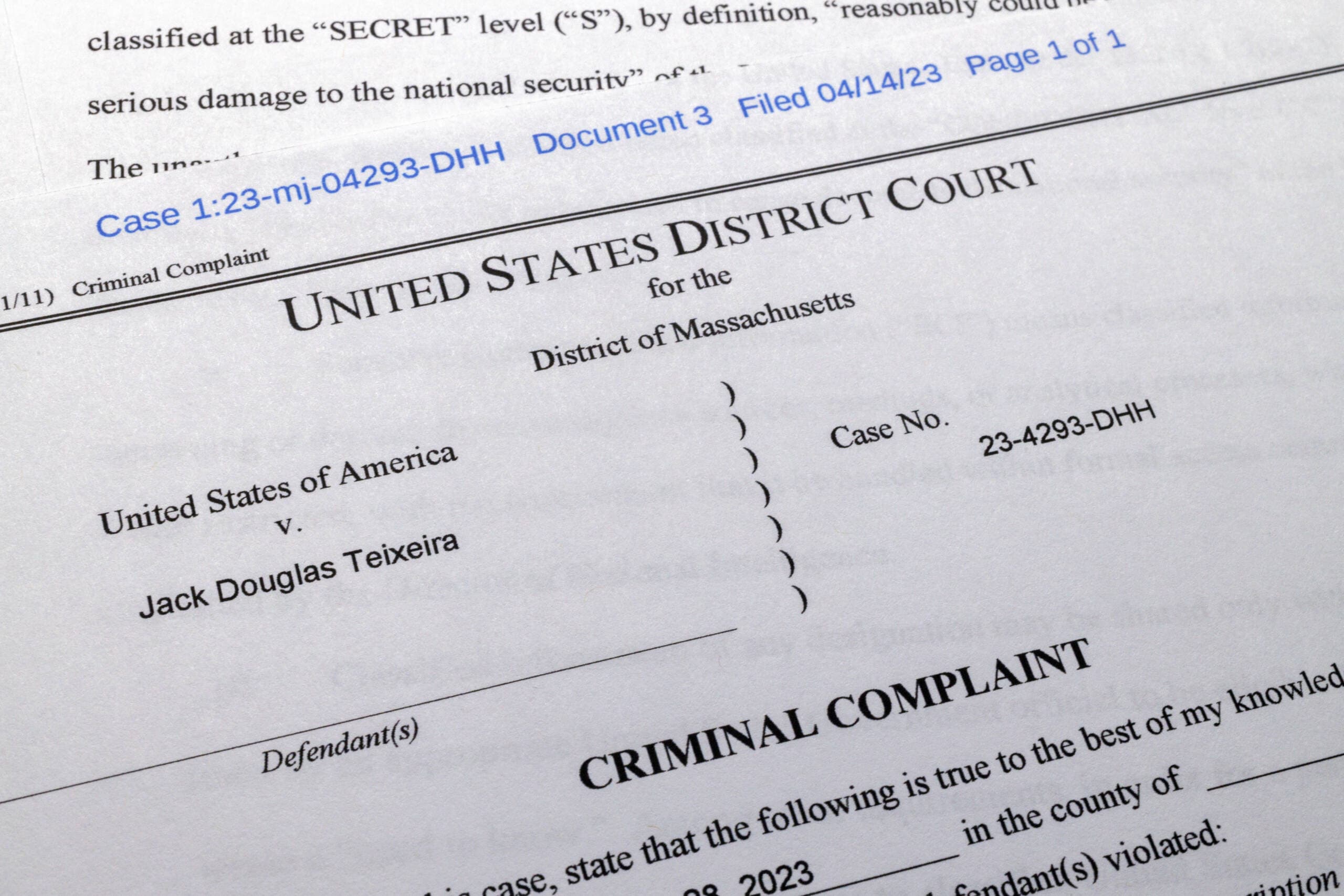 The criminal complaint against Jack Teixeira is photographed Friday, April 14, 2023. The Massachusetts Air National Guardsman appeared in court in Boston, accused in the leak of highly classified military documents. (Jon Elswick/AP)