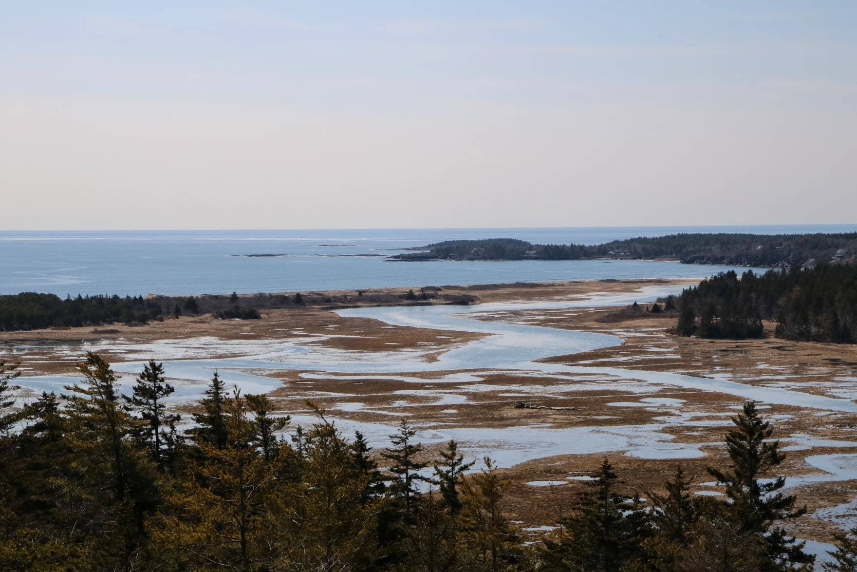 The barrier beach and marsh system at Seawall Beach and Sprague River Salt Marsh. (Murray Carpenter/Maine Public)