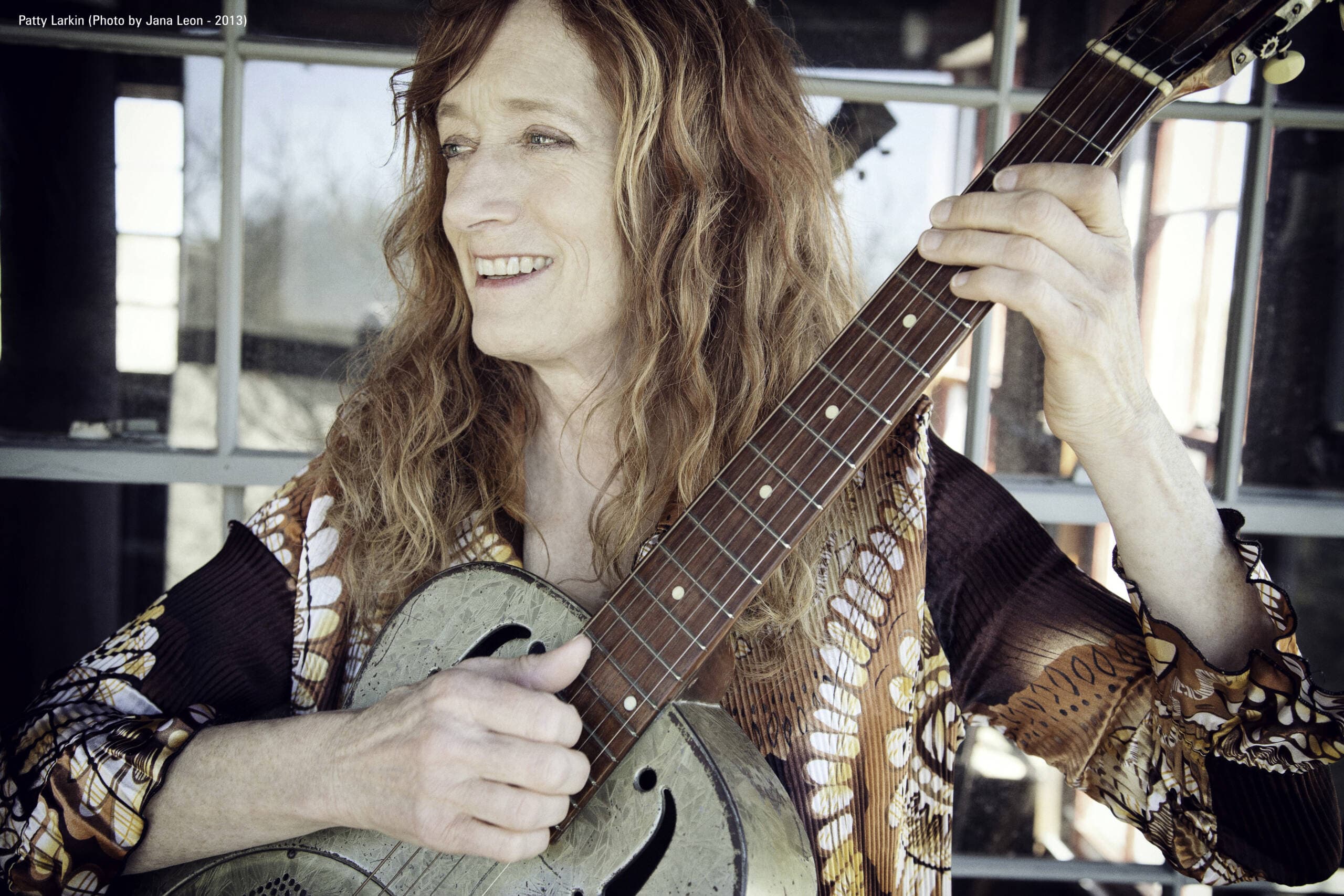 Folk singer Patty Larkin playing the dobro. (Courtesy the artist; photo by Jana Leon)