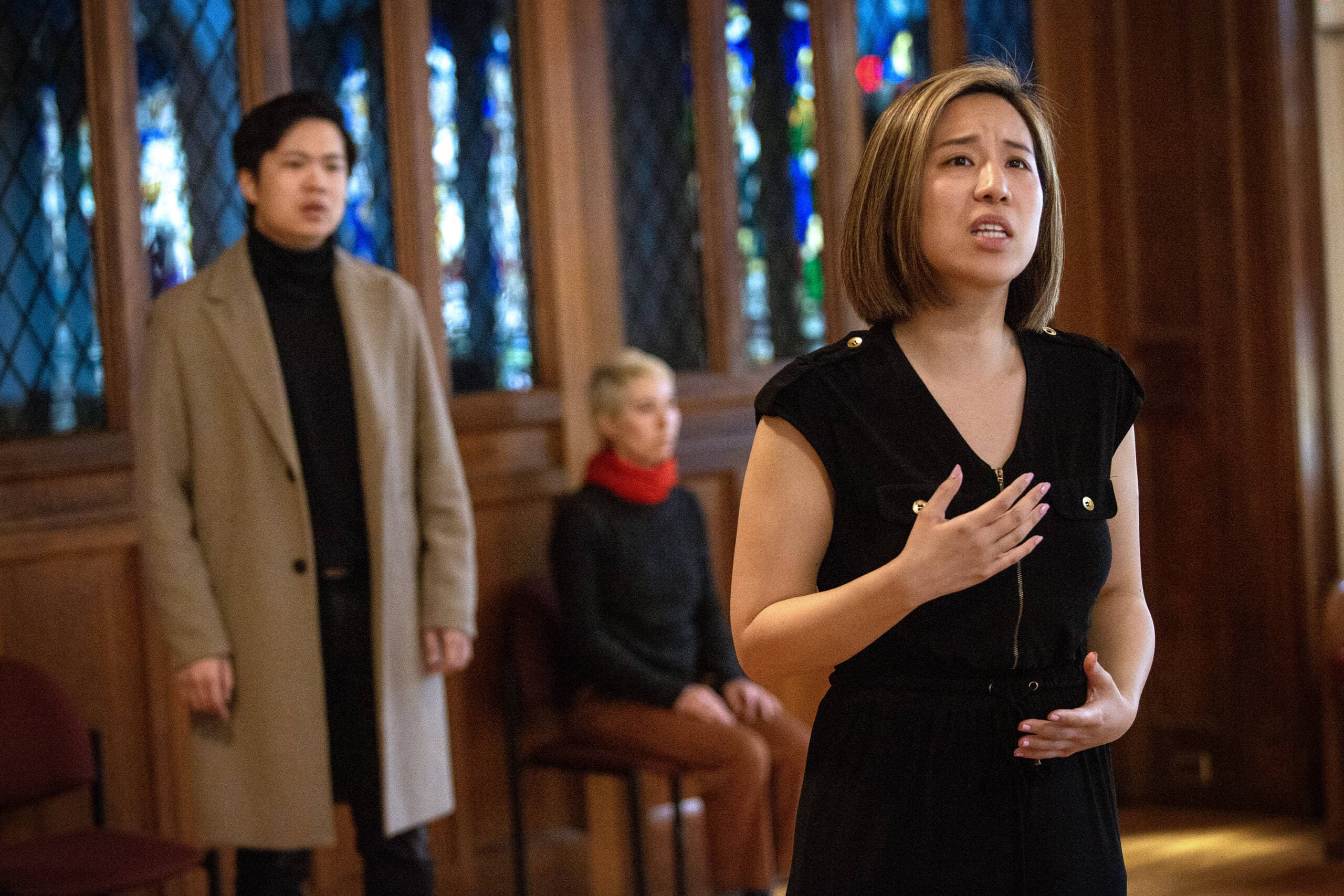 Members of the cast of Guerilla Opera's production of "HER | alive.un.dead" rehearse at Trinity Parish in Newton. (Robin Lubbock/WBUR)