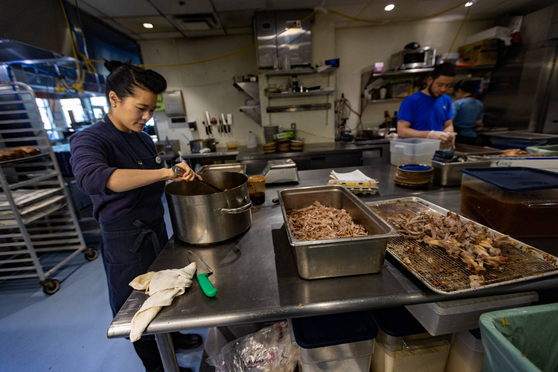 Pagu owner Tracy Chang prepares mapo tofu for for a dinner event later that evening. (Jesse Costa/WBUR)