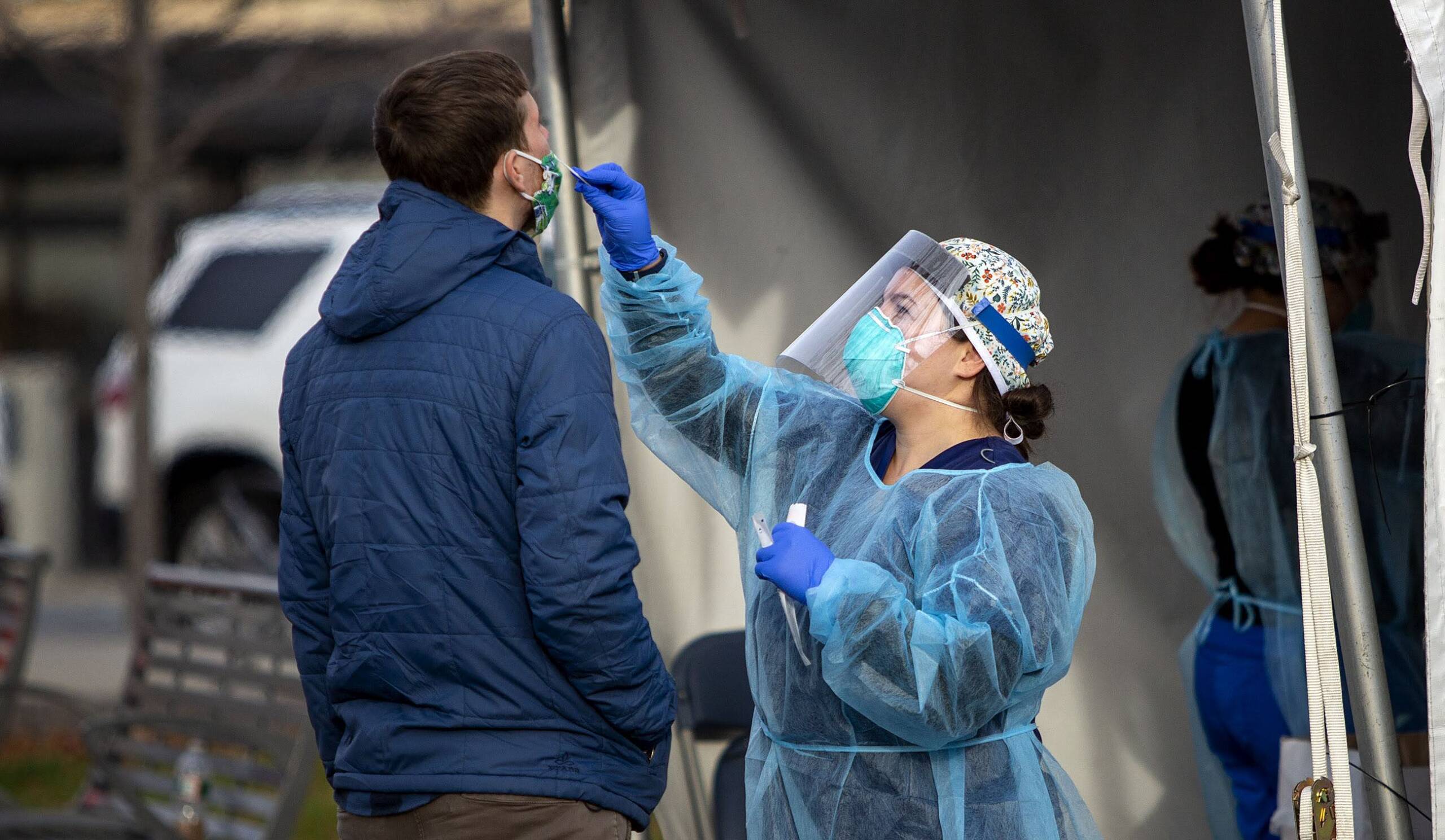 A man gets a test at the East Boston Community Health Center COVID-19 testing station at Central Square Park in November 2020. (Robin Lubbock/WBUR)