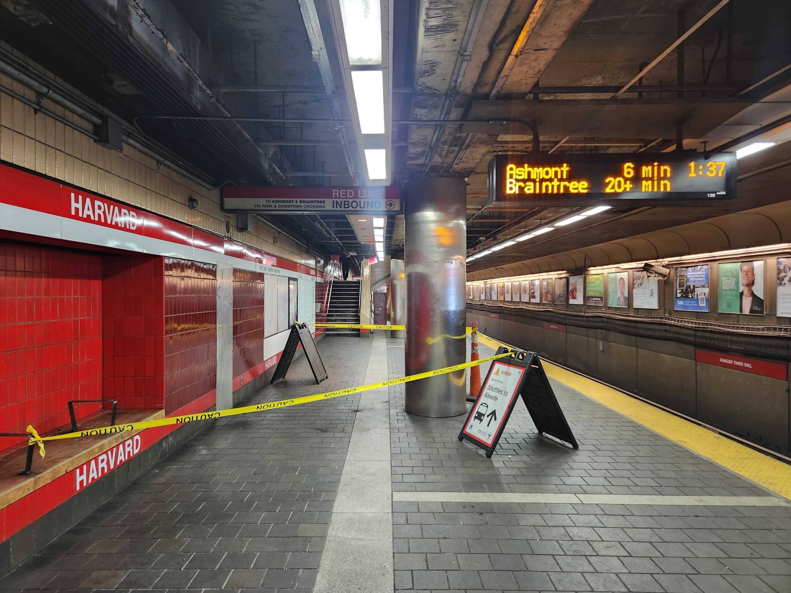 Caution tape seals off the area at Harvard station where a utility box fell from a column, grazing a passenger. (Andrea Perdomo-Hernandez/WBUR)