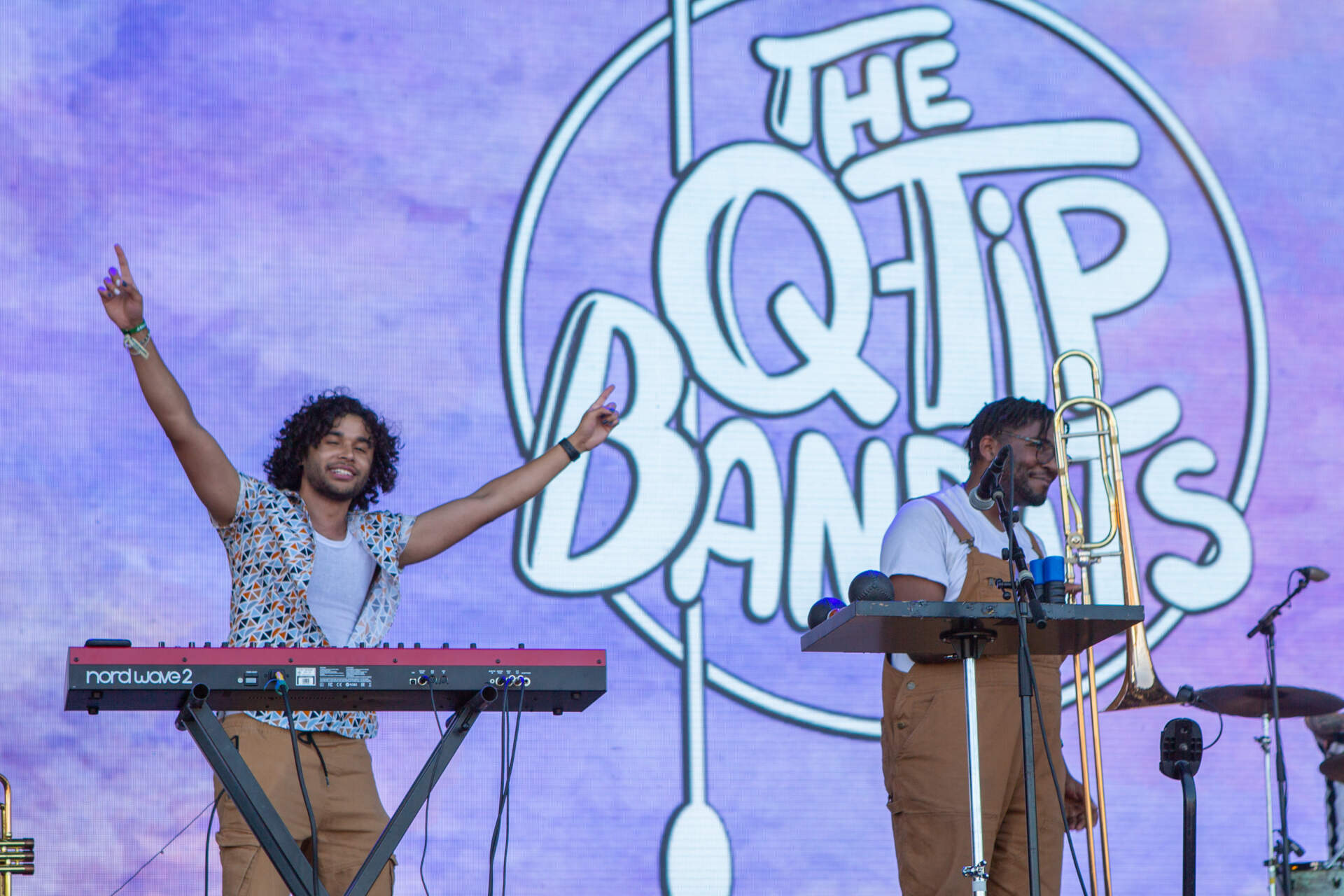 The Q-Tip Bandits horn section embrace the crowd at Day 2 of Boston Calling. Maclin Tucker (left) and Hoyt Parquet (Right) / (Jacob Garcia/WBUR)