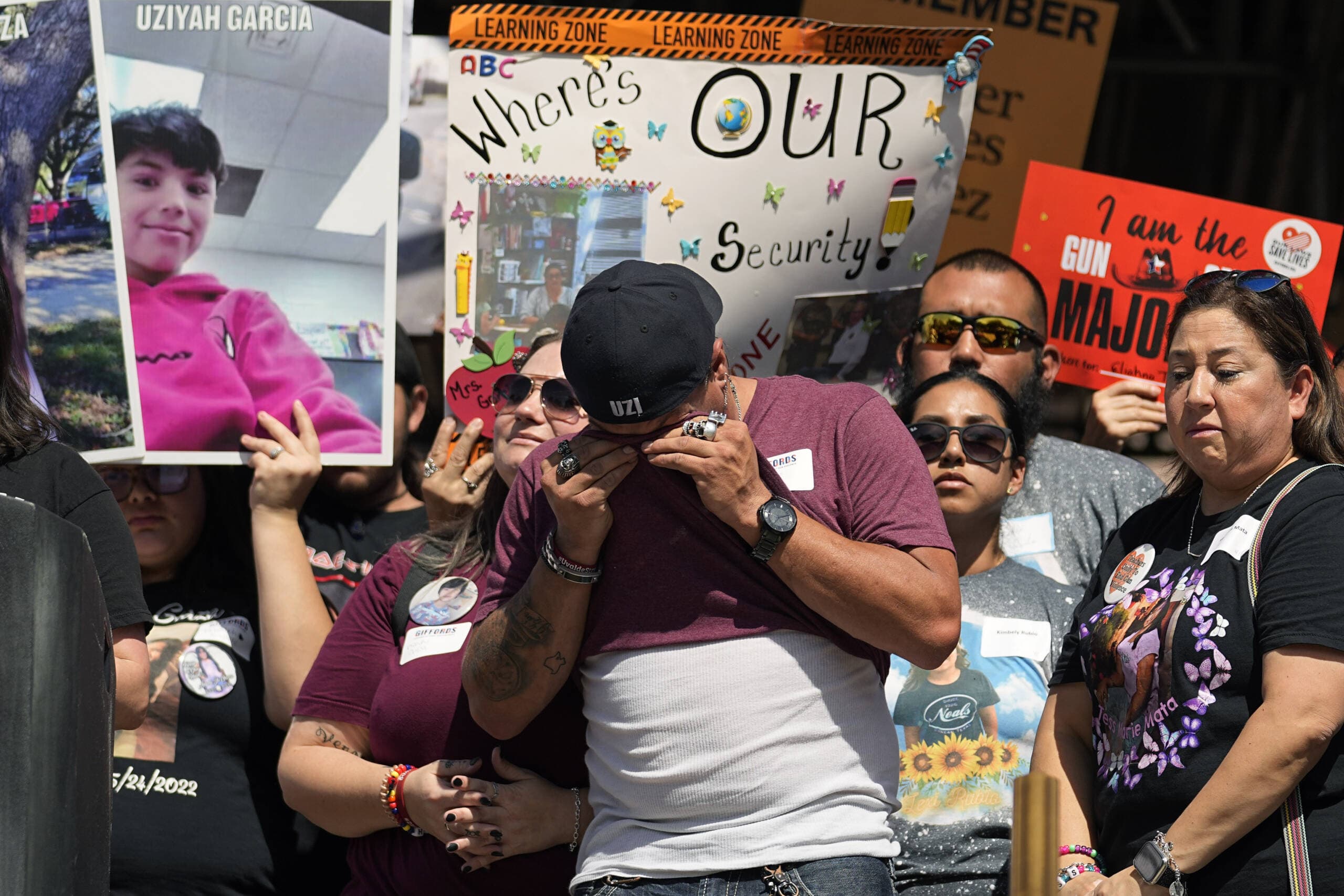 Brett Cross, father of a student killed in the shooting spree at Robb Elementary school, center, wipes away tears as he joins other advocates for control gathered at the Texas Capitol to call on Texas lawmakers to strengthen Texas' gun laws, in Austin, Texas, Tuesday, Feb. 28, 2023. (Eric Gay/AP)
