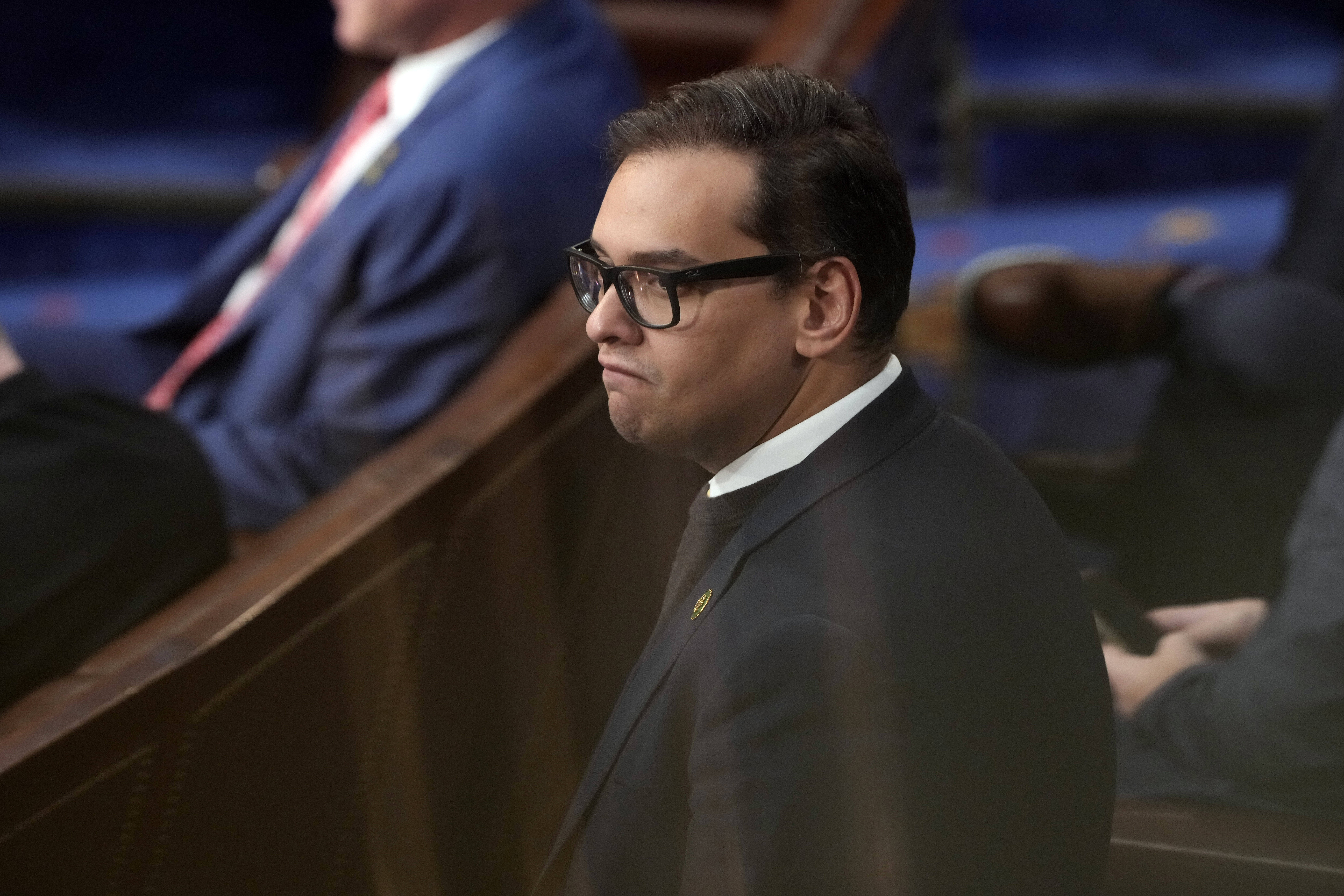 George Santos has been arrested on federal criminal charges. The Republican congressman has faced outrage over revelations he fabricated parts of his life story, including lying about being a wealthy Wall Street dealmaker. (Andrew Harnik/AP)