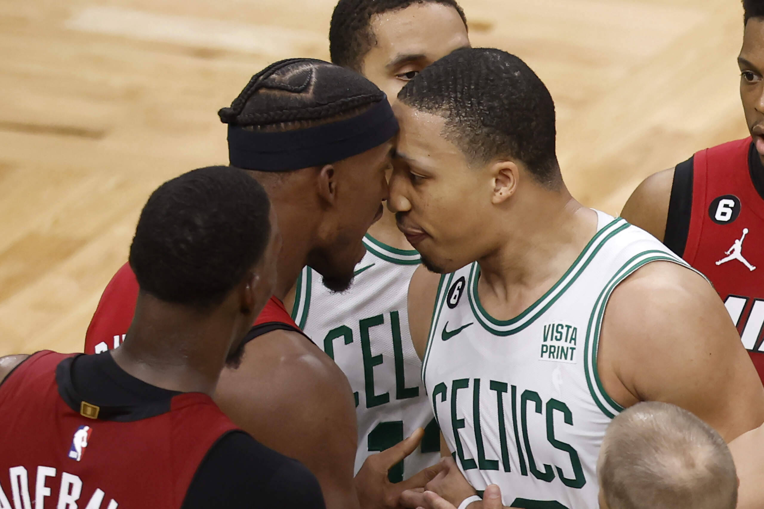 Miami Heat forward Jimmy Butler, center left, has words with Boston Celtics forward Grant Williams, center right, during the second half of Game 2 of the NBA basketball playoffs Eastern Conference finals in Boston, Friday, May 19, 2023. (Michael Dwyer/AP)