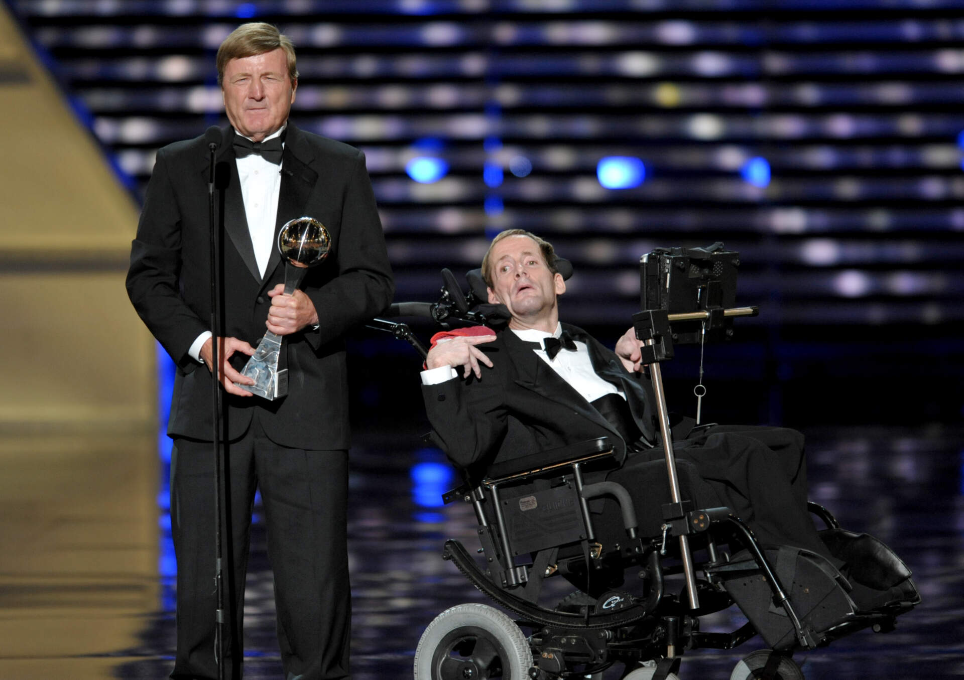 Dick Hoyt, left, and Rick Hoyt, accept the Jimmy V Perseverance Award at the ESPY Awards on Wednesday, July 17, 2013, at the Nokia Theater in Los Angeles. (John Shearer/Invision/AP)