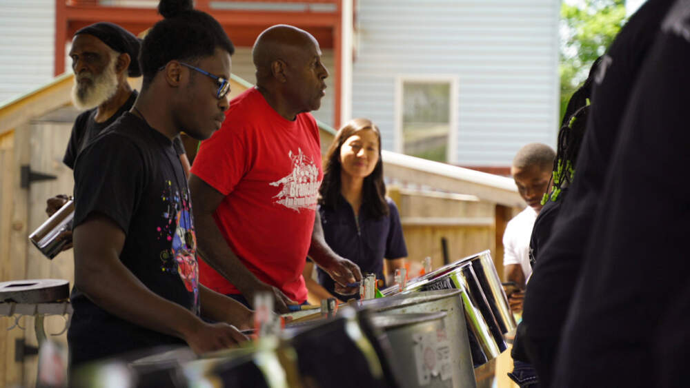 Boston Mayor Michelle Wu watches the Branches Stet Orchestra at the opening of the Edgewater Food Forest in May 2023. Courtesy Hope Kelley, Boston Food Forest Coalition