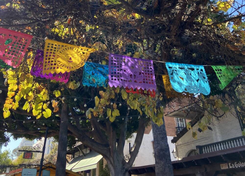 Olvera Street is lined with papel picado. (Kathy Gunst/Here & Now)