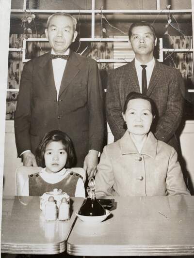 The author, her father, and her grandparents shortly after she immigrated to the U.S. (Courtesy Margaret Woo)
