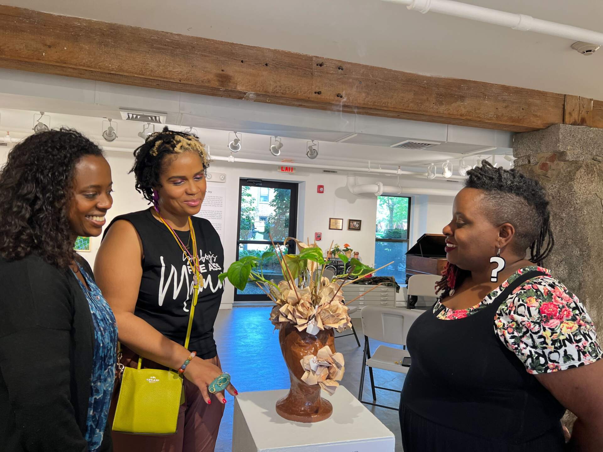 Artists Alison Croney Moses, Zahirah Nur Truth, and Tanya Nixon-Silberg at the Black Joy exhibition. (Cristela Patricia Guerra/WBUR)