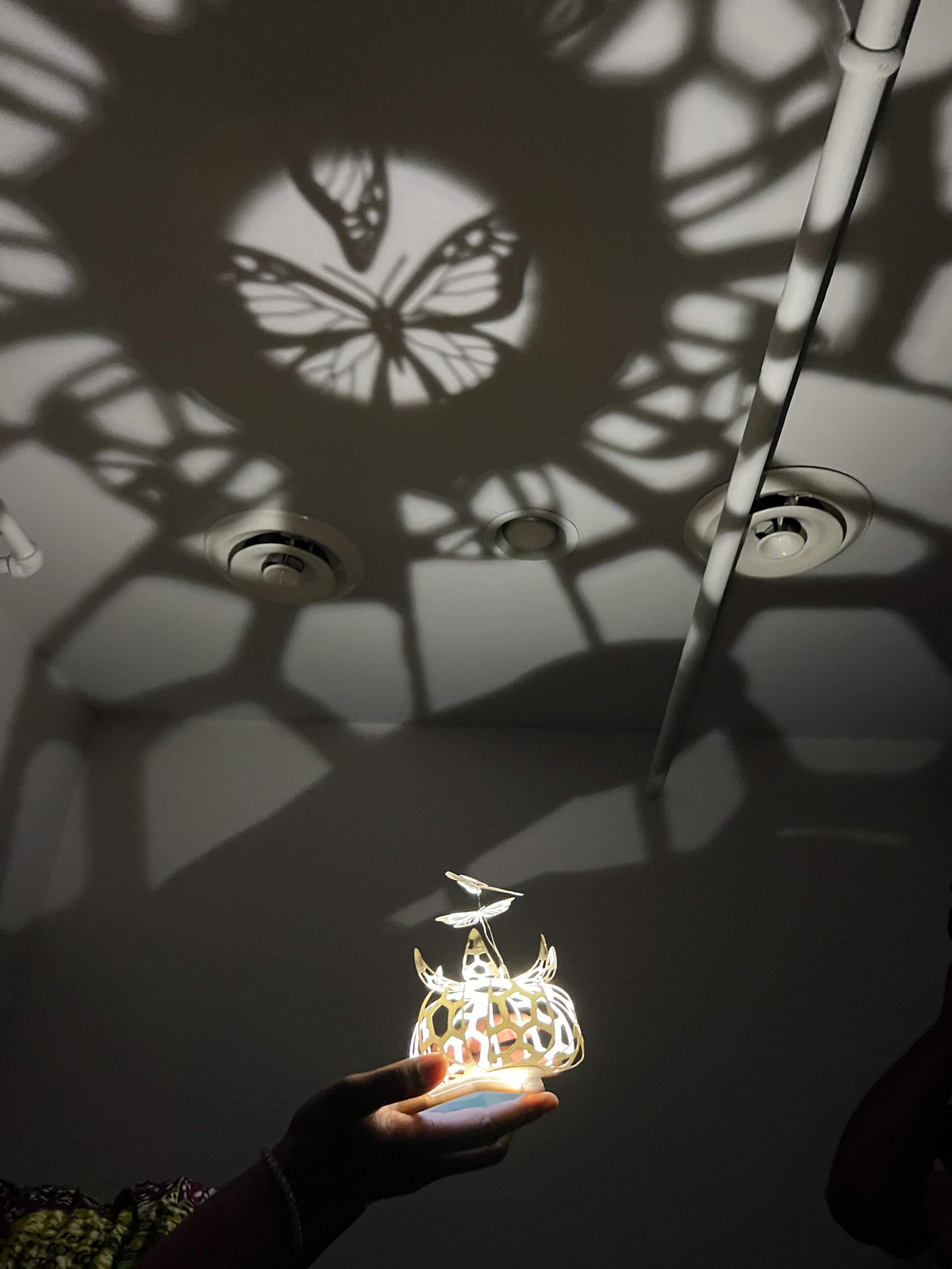 All the artists featured in the Black Joy exhibition participated in a talk back at the gallery, but just prior to the conversation was a workshop for Black mothers. Together, they crafted butterfly lanterns and talked about their lives. (Cristela Patricia Guerra/WBUR)