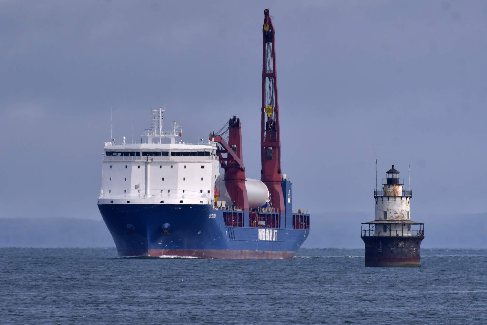 The ship UHL Felicity, carrying wind turbine tower sections, arrives in New Bedford. Once assembled by developer Vineyard Wind, the turbines at sea will stand more than 850 feet high. (Josh Reynolds/AP)