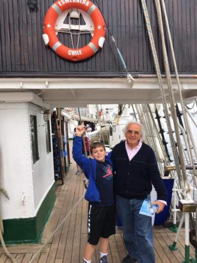 The author and his grandfather in 2017, when the Chilean tall ship, “Esmeralda,” came to Boston. The photo was taken around the time the author’s grandfather, “Papi,” was diagnosed with Alzheimer’s. (Courtesy Ethan Maggio)