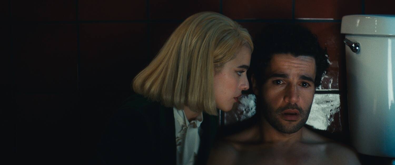 Christopher Abbott as Hal and Margaret Qualley as Rebecca in "Sanctuary." (Courtesy NEON)