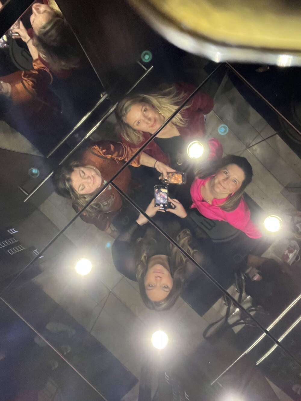 The poet and friends in an elevator. (Courtesy Kate Baer)