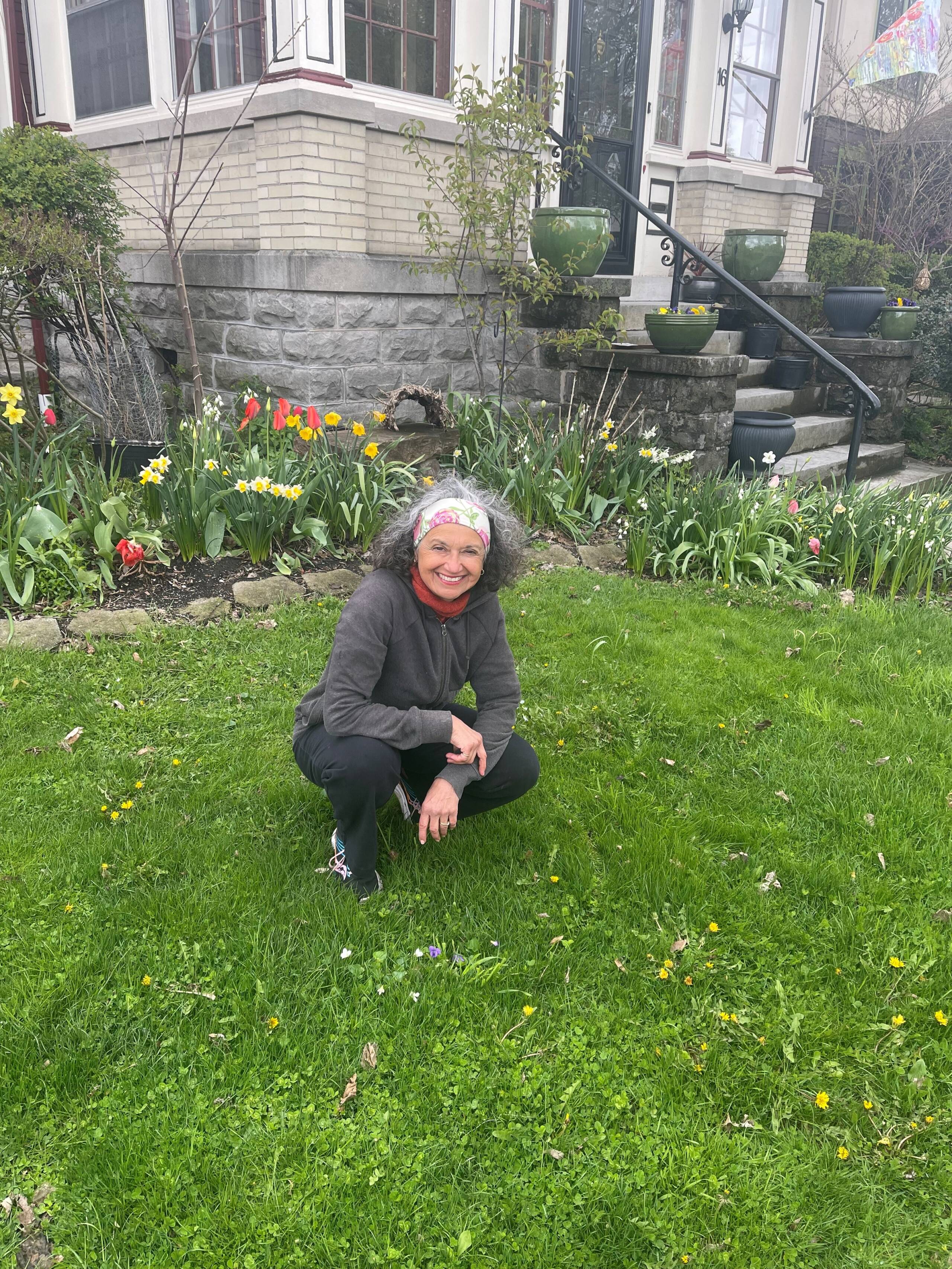 Karima Bondi poses in her yard at the beginning of No Mow May. (Courtesy of Karima Bondi)
