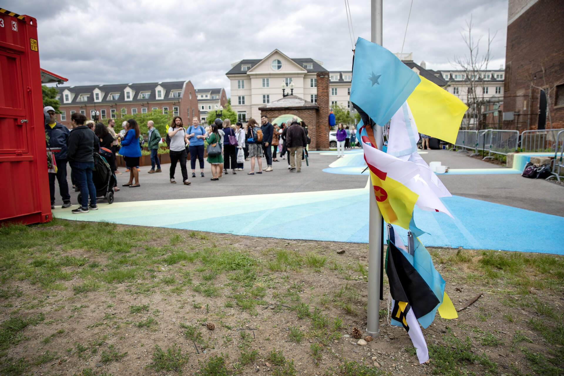 Flags created by Charlestown teens and youth for display on a flagpole at Lot Lab. (Robin Lubbock/WBUR)
