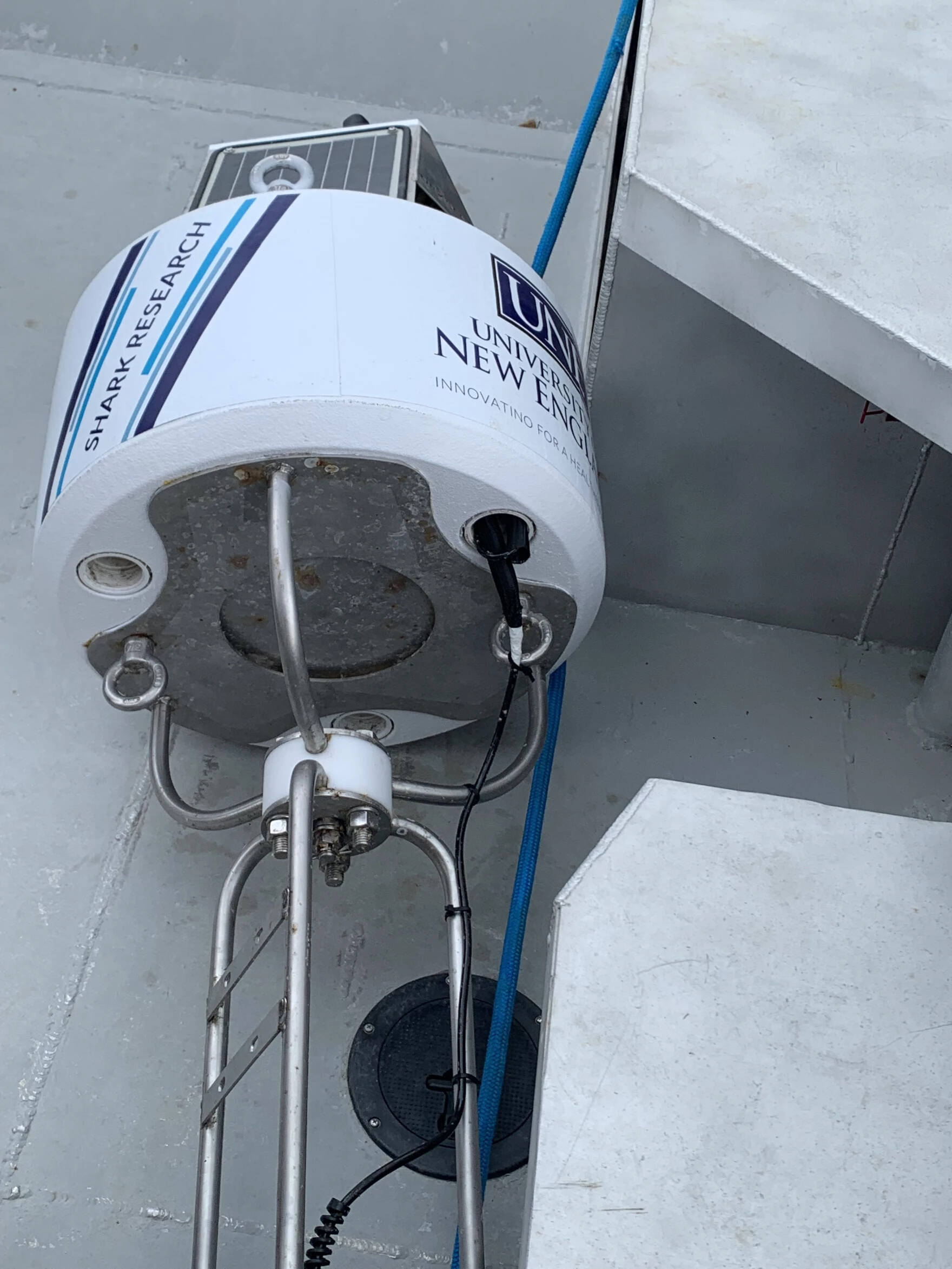 This solar-powered buoy, deployed in Saco Bay on Wednesday, June 7, 2023 by a team from the University of New England, can detect tagged white sharks and send a notice to lifeguards in real time. (Nicole Ogrysko/Maine Public)