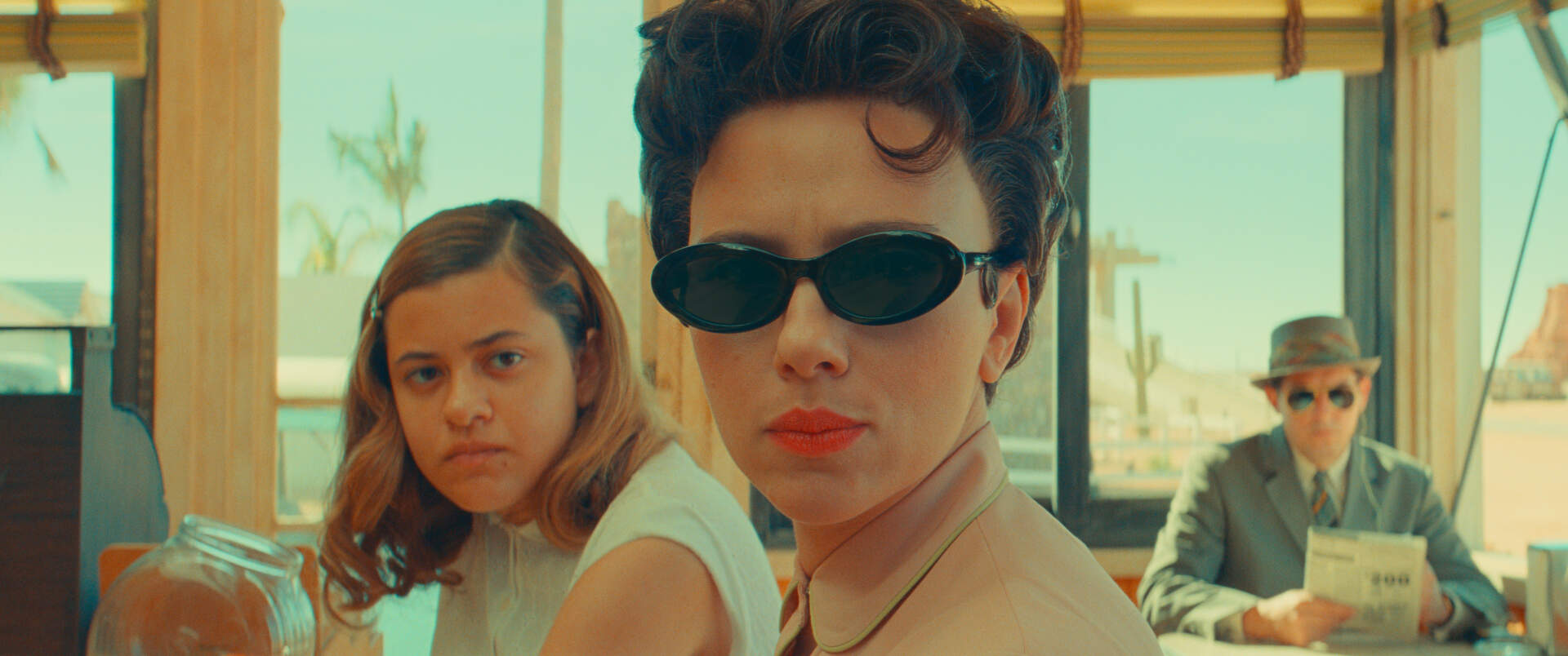 Left to right, Grace Edwards as Dinah, Scarlett Johansson as Midge Campbell and Damien Bonnaro as &quot;Bodyguard/Driver&quot; in writer-director Wes Anderson's &quot;Asteroid City.&quot; (Courtesy of Pop. 87 Productions/Focus Features)