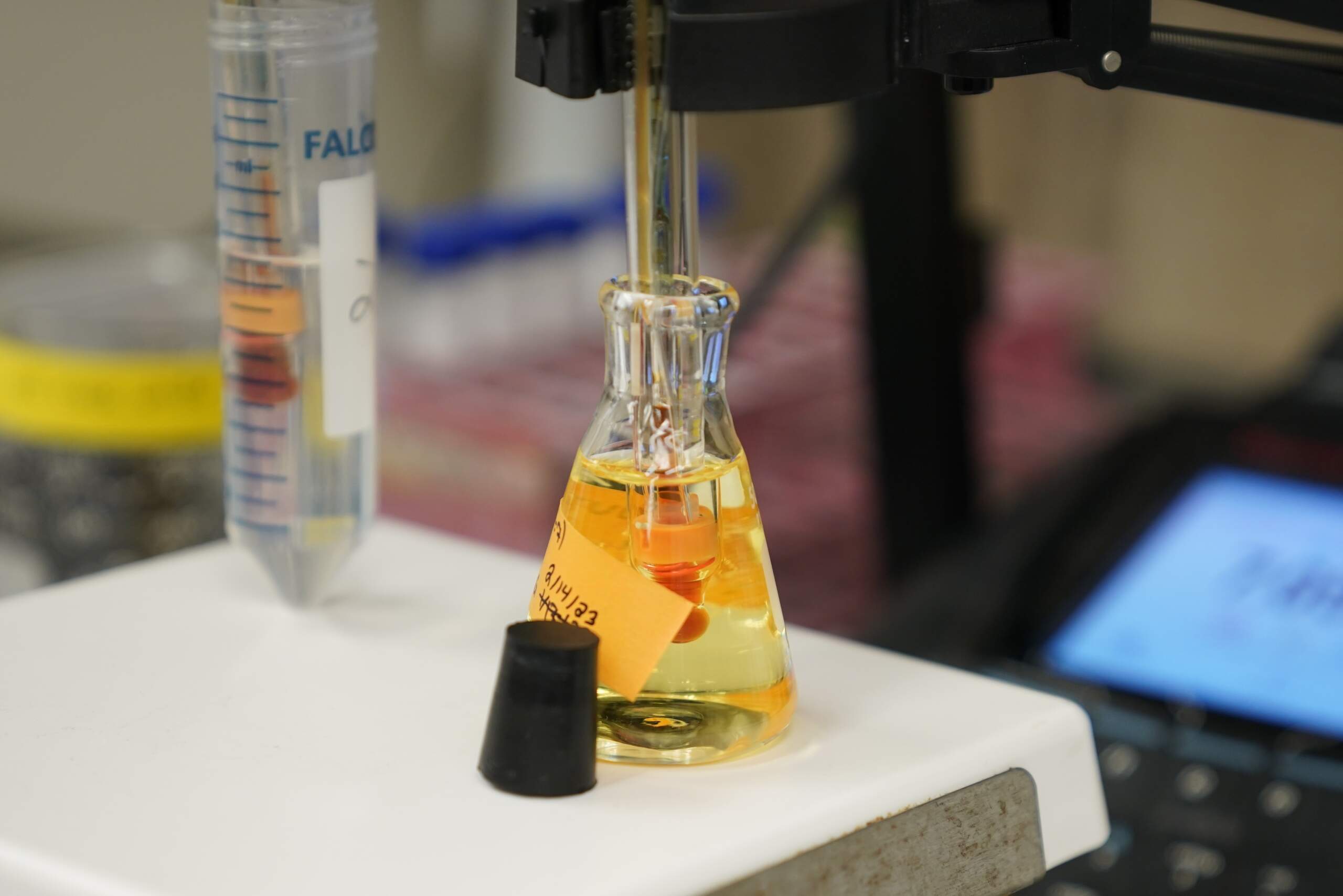 A water sample is measured as part of a PFAS drinking water treatment experiment. (Joshua A. Bickel/AP)