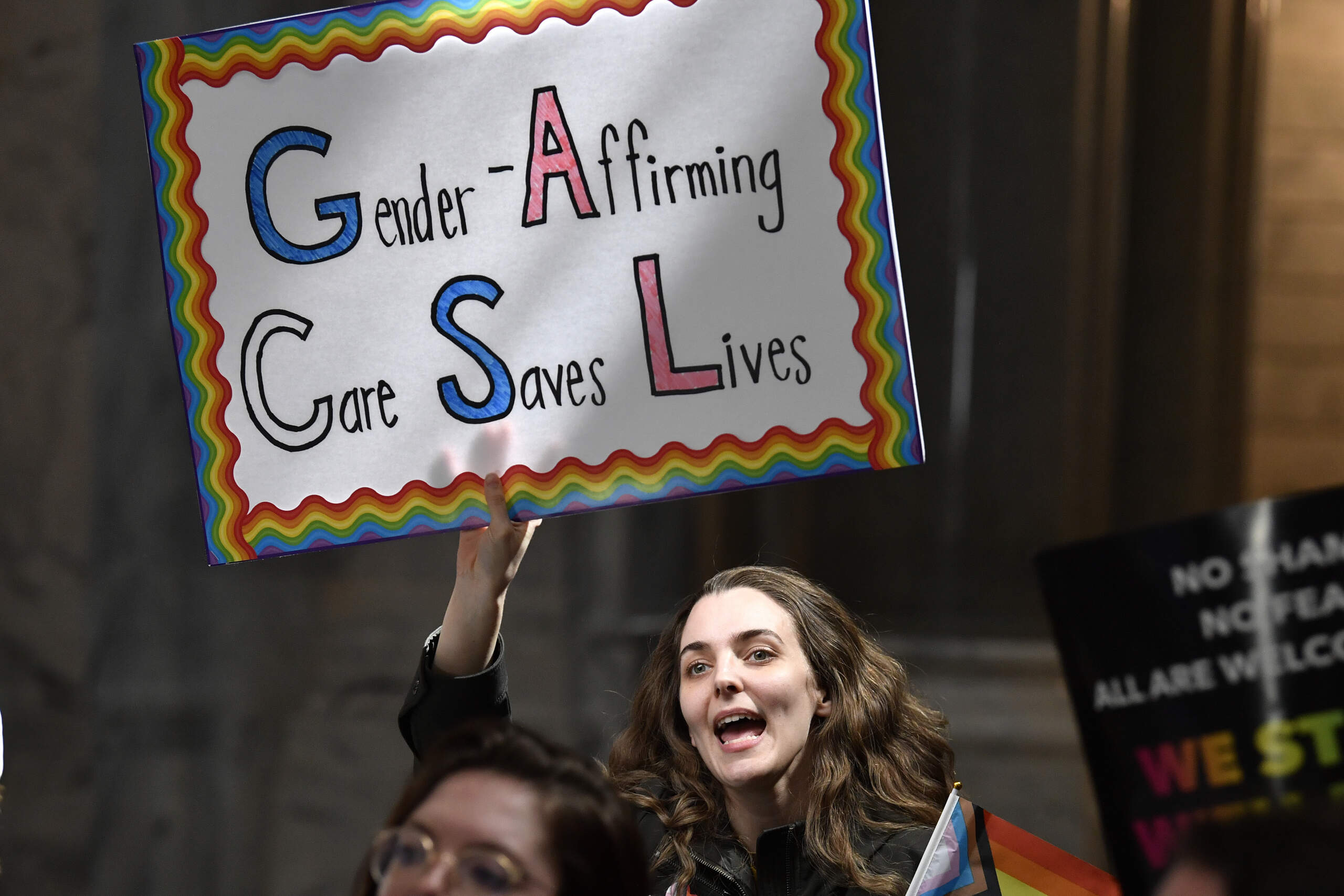 A protester shows her opposition to Kentucky Senate bill SB150, known as the Transgender Health Bill outside the Senate chamber at the Kentucky State Capitol in Frankfort, Ky., Wednesday, March 29, 2023. (Timothy D. Easley/AP)