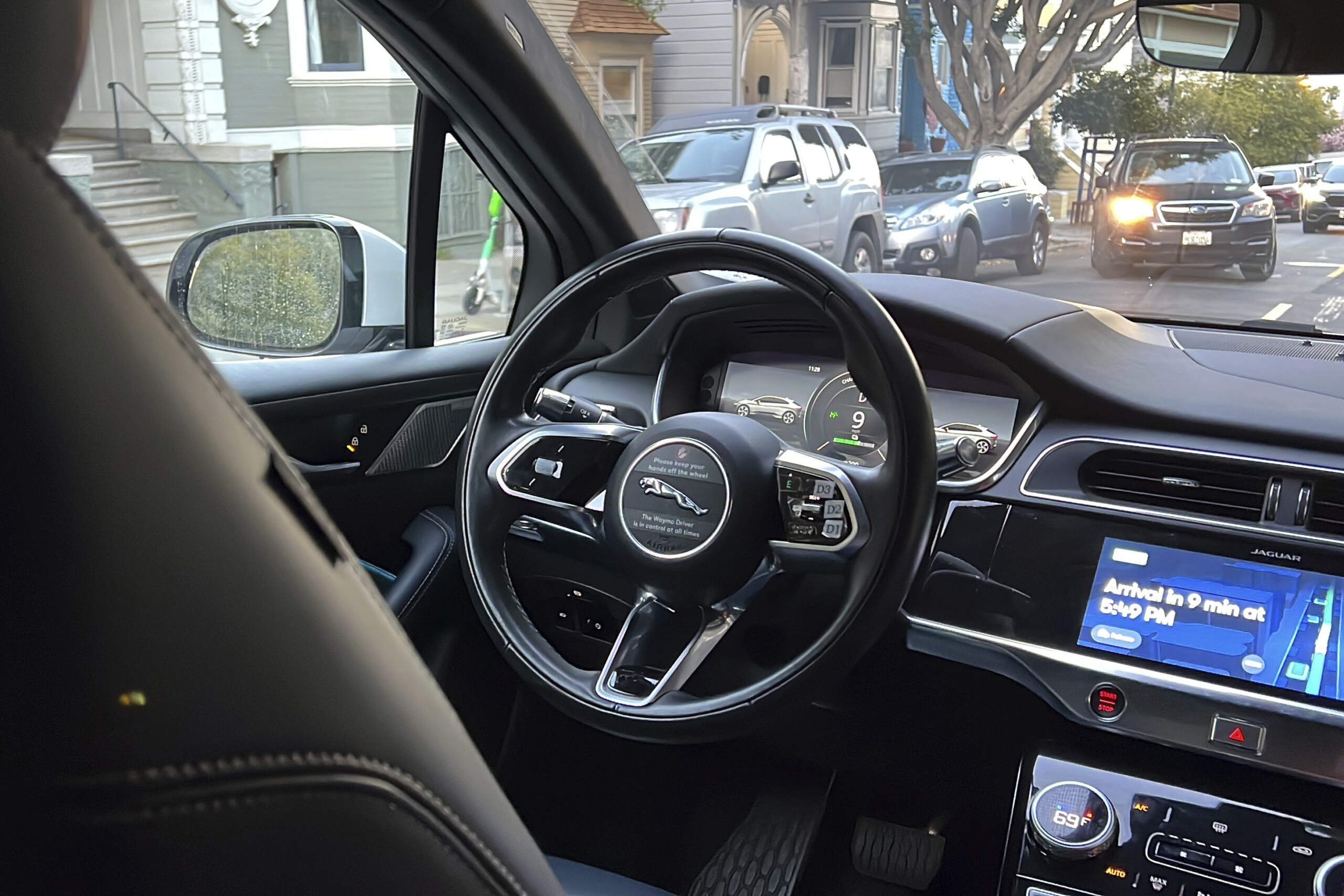 A Waymo driverless taxi drives on the street during a test ride in San Francisco. (Terry Chea/AP)