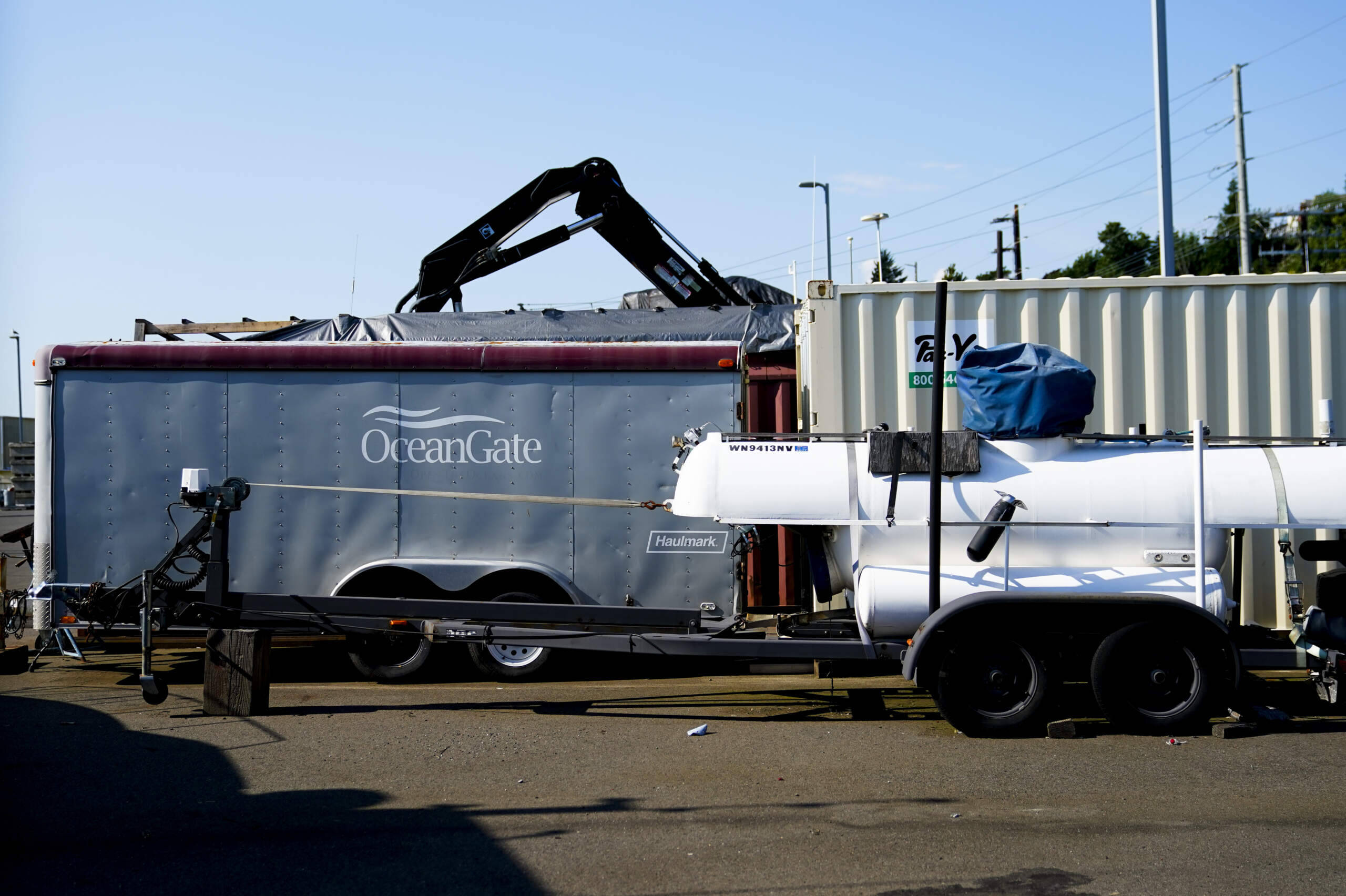 Equipment with the OceanGate logo is parked on a lot near the OceanGate offices Thursday, June 22, 2023, in Everett, Wash. The U.S. Coast Guard said Thursday that the missing submersible Titan imploded near the Titanic shipwreck site, killing everyone on board. (Lindsey Wasson/AP)
