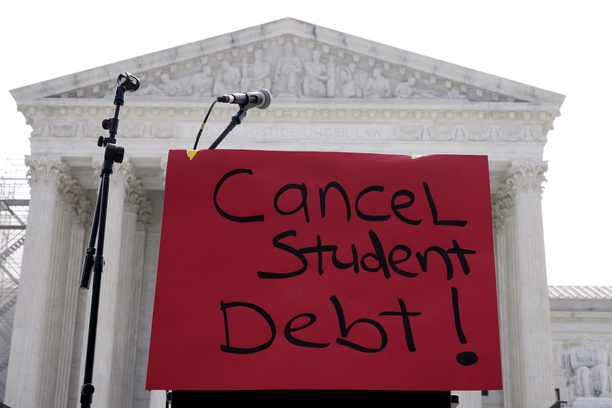 A sign reading "cancel student debt" is seen outside the Supreme Court, Friday, June 30, 2023. (Mariam Zuhaib/AP)