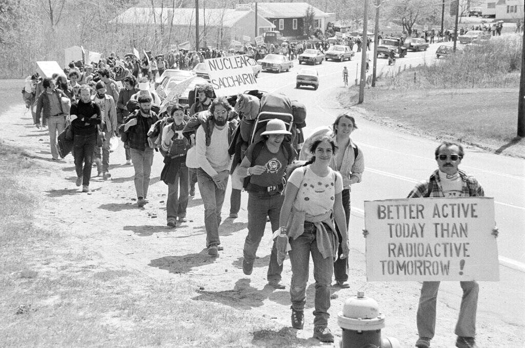 Anti-nuclear power demonstrators march toward the front gate of the Seabrook, N.H., nuclear power station construction site Saturday, April 30, 1977. (AP Photo)