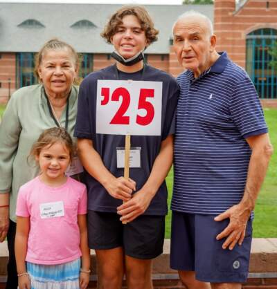 The author with his grandfather, “Papi,” his grandmother, and his younger sister, Aria (age 7 at the time), in 2021, at St. Paul’s School, Concord, NH. (Courtesy St. Paul's School via Ethan Maggio)