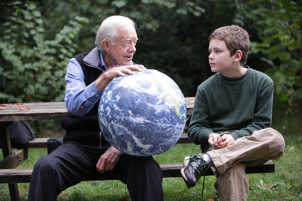 immy Carter talks with his grandson Hugo Wentzel, 10, during a picnic on October 31, 2009, in Istanbul, Turkey. (Jeff Moore/The Elders via Getty Images)